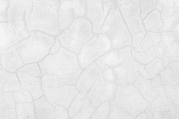 abstract of cement cracked texture on old white masonry wall