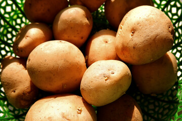 above shot of fresh potatoes group on basket