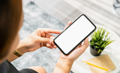 Closeup of woman hand holding smartphone and the screen is blank, social network concept.