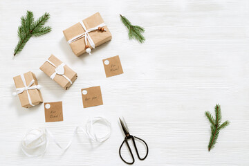 Homemade gift box with tags for family, Christmas present box wrapped in kraft paper