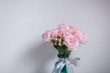 Beautiful flowers in the glass vase.