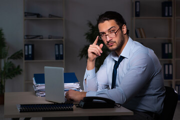 Young businessman working late in the office