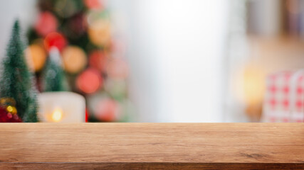 Empty wood table top on blur with bokeh Christmas tree and new's year decoration on window banner background - can be used for display or montage your products.