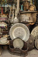 Fototapeta na wymiar Old metal kitchenware displayed in the antique shop