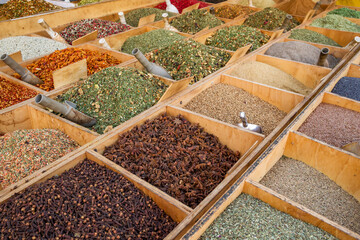 Wide variety of spices on a street market stall in Sicily, Italy
