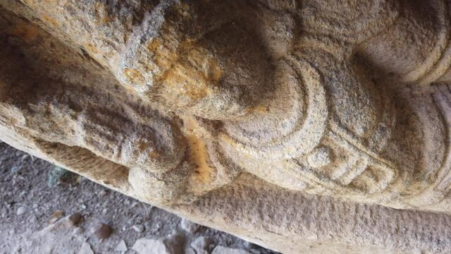 Beautiful Tracking Shot Around Stone Figure on Ruined Temple at Hampi, Karnataka, India.