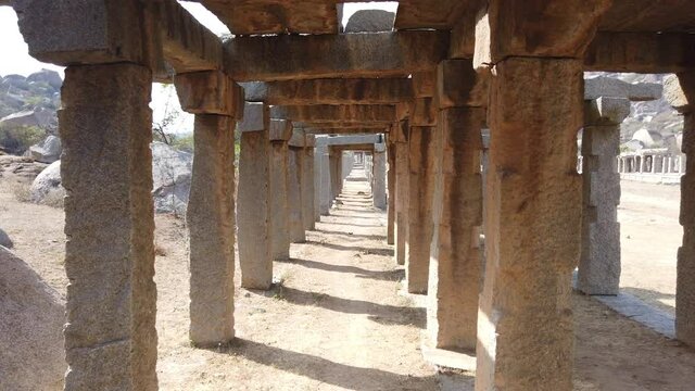 Tracking Shot Through Collonade of Ruined Temple at Hampi, Karnataka, India.