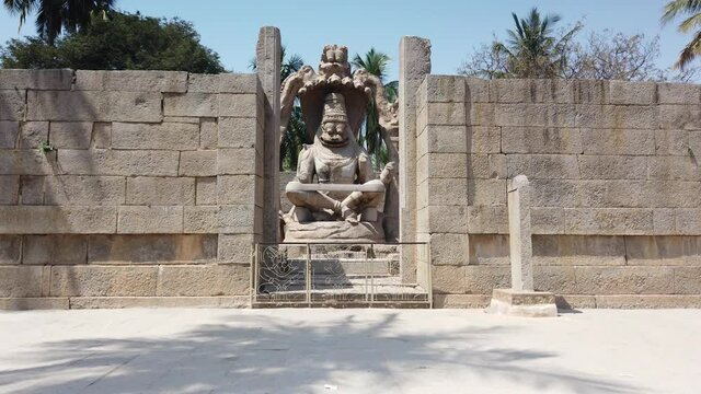 Rapid Tracking Shot into Giant Statue at Hampi, Karnataka, India.