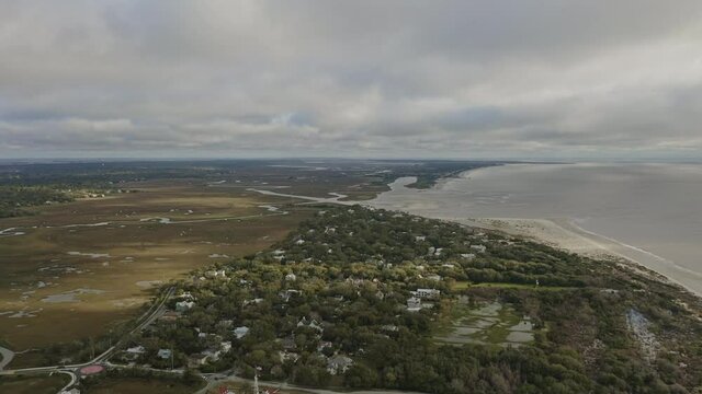 St Simons Georgia Aerial v2 slow birdseye shot of waterside neighborhood and Atlantic Ocean - March 2020