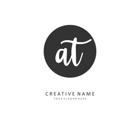 A T AT Initial letter handwriting and signature logo. A concept handwriting initial logo with template element.