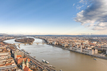 Aerial drone shot of Hungarian Parliament by Danube from Buda hill in Budapest winter morning