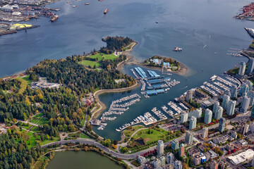 Aerial view of Coal Harbour and a modern Downtown City during a vibrant sunny morning. Taken in Vancouver, British Columbia, Canada. © edb3_16