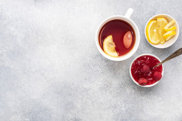 Lemon raspberry jam hot tea. Warming products for the prevention of colds and flu. Copy space.