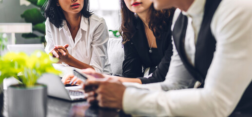Group of professional business discussing meeting strategy sharing ideas thoughts with project.Creative business people working with laptop computer in green plant terrace decorated modern workloft