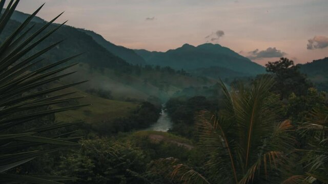 Sunset time lapse of nature, mountains, plants and a river in Lanquin, Semuc Champey, Guatemala.