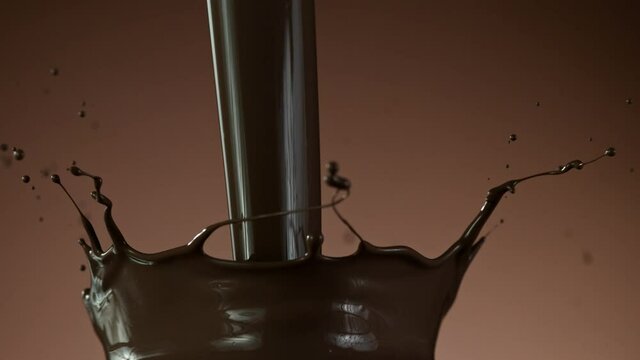 Super slow motion of pouring dark hot chocolate. Filmed with cinema high speed camera, 1000fps.