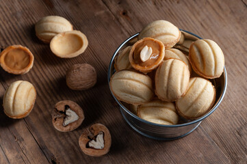  cookies nuts with caramel on an old wooden background
