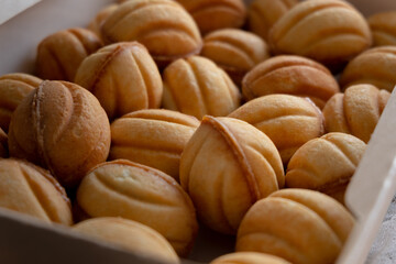  cookies nuts with caramel on an old wooden background