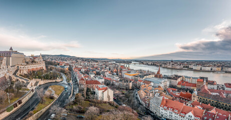 Fototapeta premium Aerial Panoramic drone shot of Matthias Church on Buda hill in Budapest before sunrise in winter