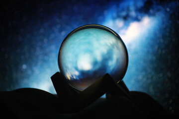Astrological background. Crystal ball with predictions. Horoscope of the stars. Fortune telling and determination of fate. Soothsayer with a crystal ball. - obrazy, fototapety, plakaty