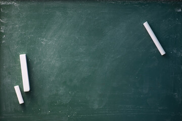 Chalkboard. Crayons for writing on a blackboard. Learning concept. School teaching chalk board.