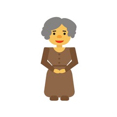 A woman with gray hair in a brown dress with buttons and a belt in brown shoes stands and smiles. 