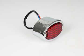 vintage retro chrome and red motorcycle rear small brake light of classic motorbike