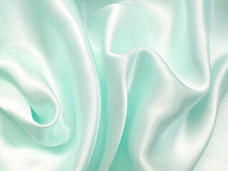 Texture satin. silk background. shiny wavy pattern canvas. color fabric, cloth