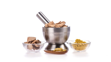 
Phlai or Zingiber montanum dried slice and powder placed isolated on a white background.