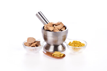 
Phlai or Zingiber montanum dried slice and powder placed isolated on a white background.