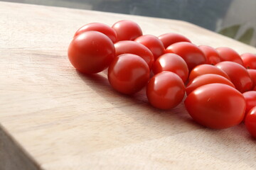 Cherry Tomatoes on a wooden chopping board