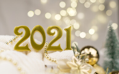 Year 2021 numbers on Golden bokeh background New year mood, Christmas, greeting card, new year background