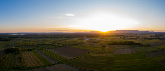 Obraz premium Aerial view of sunset above plantations at the countryside, Croatia.