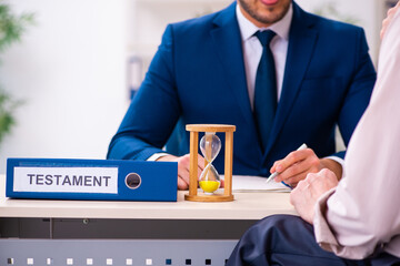 Young male lawyer and old man in testament and time management c