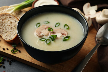 Concept of tasty lunch with bowl of mushroom soup, close up