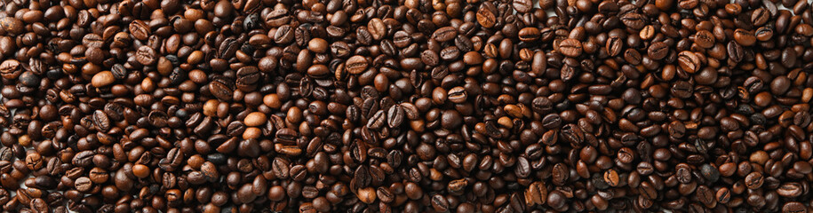 Pile of coffee beans on white background, top view