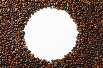 Roasted coffee beans on white background, space for text