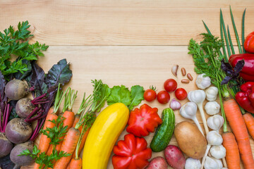 Fresh ripe organic vegetables on a wooden table
