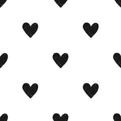 Valentine's Day block print seamless pattern with grunge textured black hearts on white background