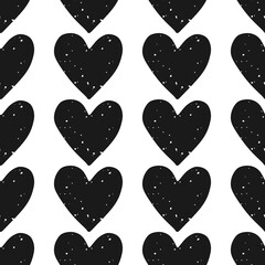 Valentine's Day block print seamless pattern with rows of grunge textured black hearts on white background