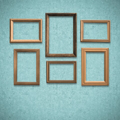 Fototapeta premium frames on old blue wall