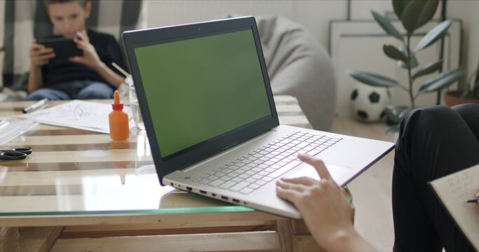 Woman Holding Computer With Green Screen