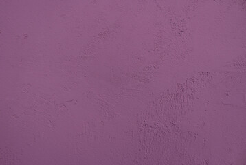putty textured purple wall close up