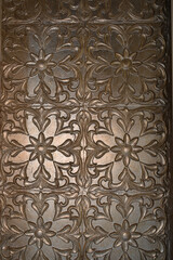 designer symmetrical fall ceiling pattern made of mud and plated with gold and silver with ceiling led lights