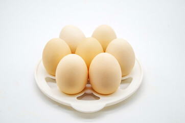 Farm eggs on a white background