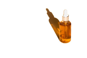 Glass bottle and dropper OIL on white isolated background. Laboratory Production of cosmetics with oil.