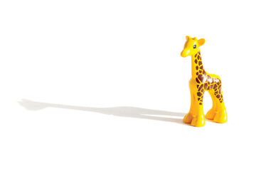 toy yellow giraffe ON A WHITE BACKGROUND, HORIZONTAL ORIENTATION, ISOLATED