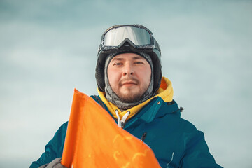 portrait of a snowboarder with helmet and goggles