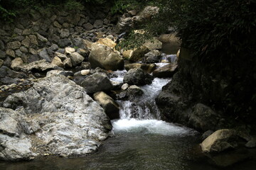 dark waterfall in the mountains