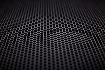 A black metal grate as a background.